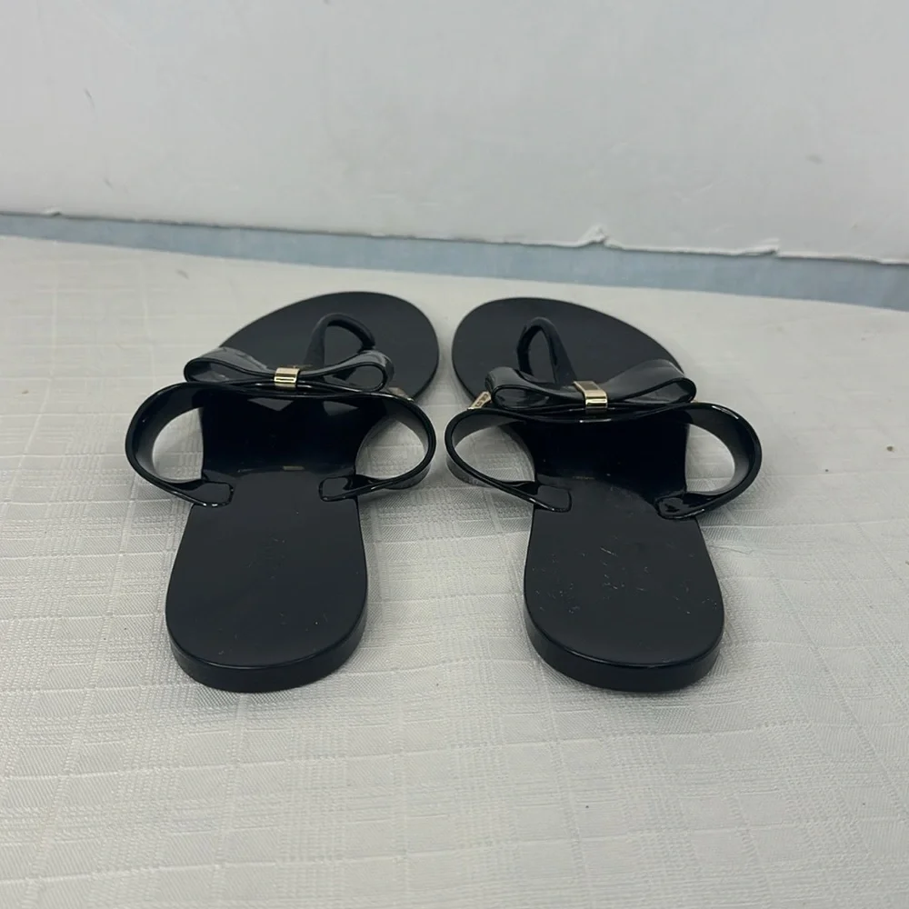 Michael Kors Kayden Jelly Bow Tie Thong Sandals in Black. Size 10.